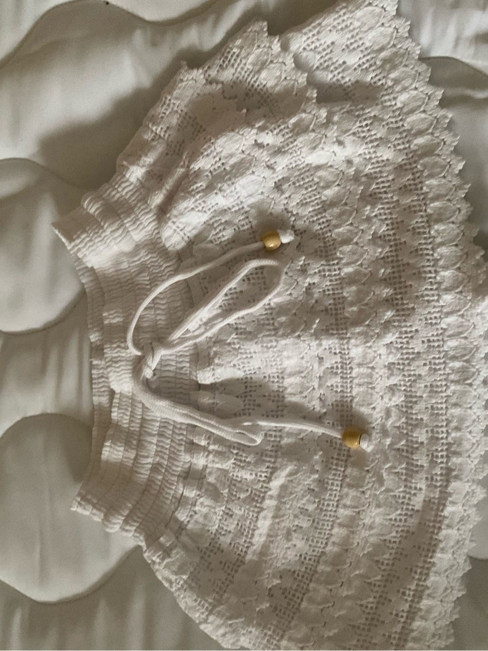 White Off-the-Shoulder Crochet Knit Sweater with Drawstring Detail